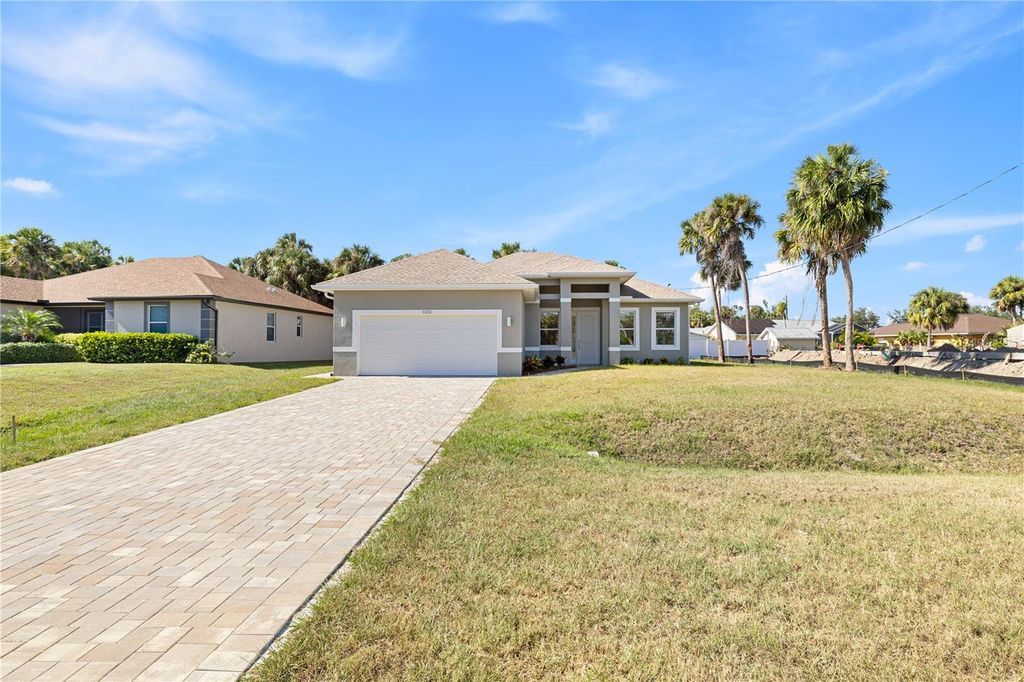 Photo of 1231 S San Mateo Drive, North Port, FL 34288 (MLS # O6335981)