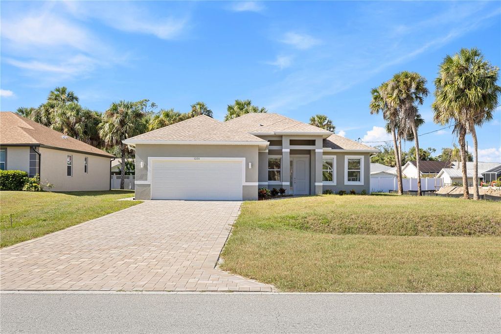 Photo of 1231 S San Mateo Drive, North Port, FL 34288 (MLS # O6335981)