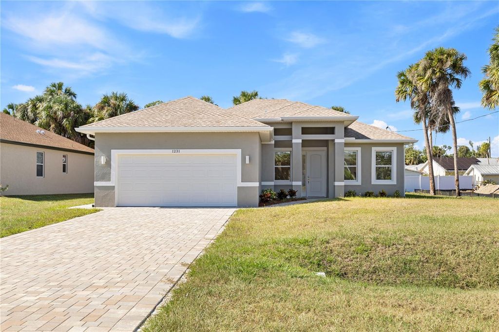 Photo of 1231 S San Mateo Drive, North Port, FL 34288 (MLS # O6335981)