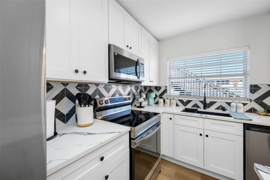 Photo of 1433 S Belcher Road #F9, Clearwater, FL 33764 (MLS # TB8502716)