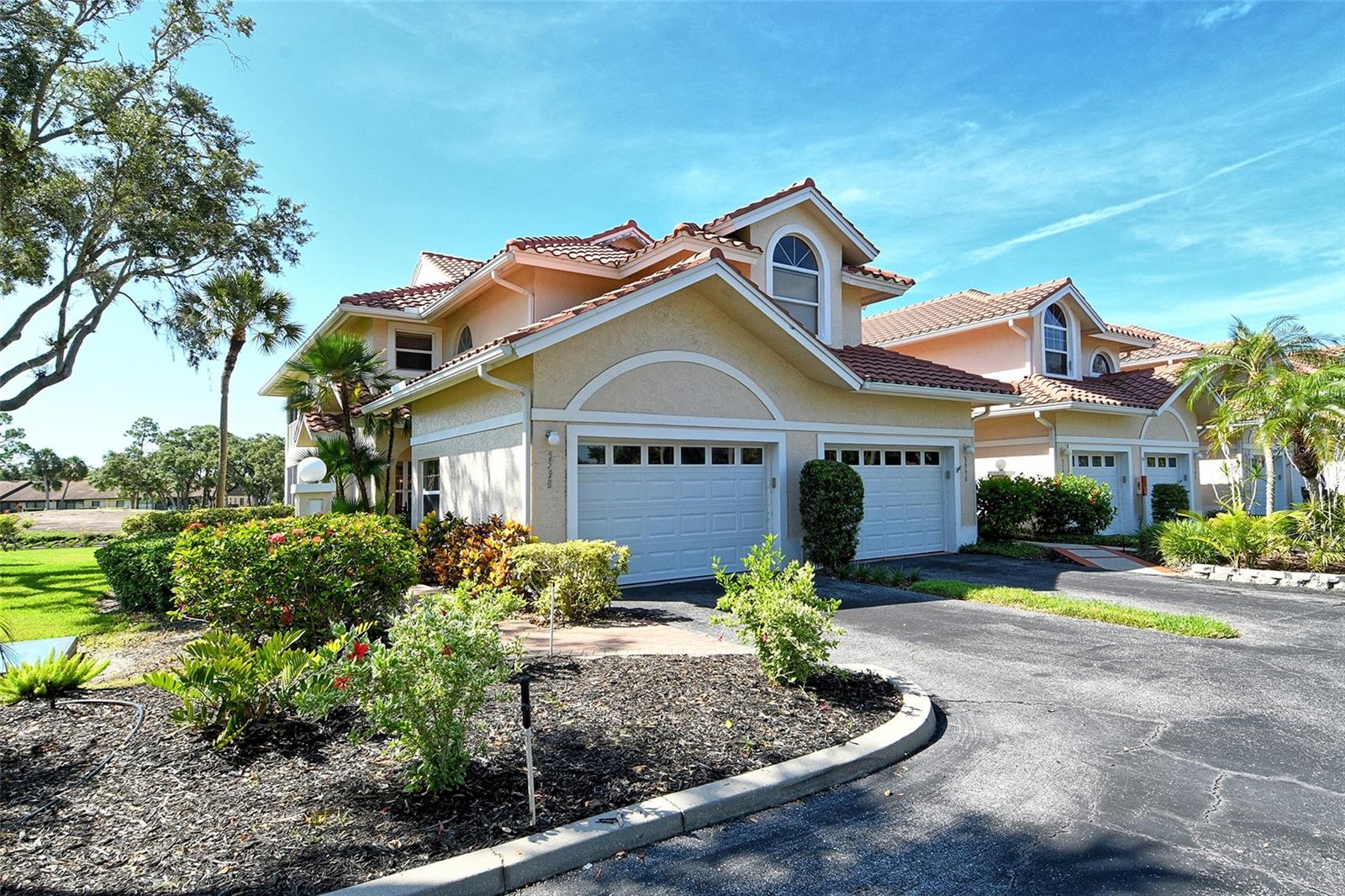 WELCOME HOME to your 2-bedroom, 2-bathroom condominium located in the park-like setting in the Callaway Glen community in the Golf Pointe neighborhood at Palm-Aire. Panoramic views of the 15th Hole of Palm Aire golf course and water views. Situated on corner unit provides bright and open views of nature and marvelous landscaping of the golf and dining area combination, creating an inviting atmosphere for both relaxation and entertaining. The generous screened porch showcases picturesque golf and lagoon vistas, providing a peaceful backdrop to enjoy for your morning coffee or evening unwinding. The galley kitchen features warm cabinetry, and granite countertops. One oversized garage. In-unit laundry room. New AC in 2023. Reflex in your family room. The second bedroom can double as an office or a den. Plenty of storage throughout. Palm Aire Golf & Country Club residents enjoy access to the clubhouse, heated swimming pool, 36-hole championship golf course, fitness center, tennis and pickleball courts, as well as numerous social clubs and activities. This prime location puts you moments away from University Town Center (UTC), Benderson Park, SRQ Airport, and a diverse array of dining and shopping destinations. No CDD fees and optional golf membership.