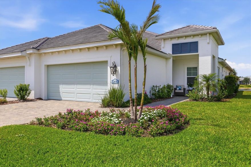 Experience elevated Florida living in this stunning 2024-built Tidewinds 2 villa located in the highly sought-after Grand Palm community. An award-winning community with resort-style amenities and lush green spaces, miles of trails, and a vibrant lifestyle. This professionally decorated 2-bedroom, 2-bath home with a versatile flex room showcases a spectacular full-length pond view and offers more upgrades than the builder's model. Designed with both luxury and comfort in mind, the open-concept floor plan features luxury vinyl flooring throughout, soaring 9-foot doors, crown molding, and an expansive pocket sliding glass door that seamlessly blends indoor and outdoor living. The extended lanai creates the perfect space to relax and enjoy tranquil waterfront sunsets, while hurricane impact windows provide peace of mind year-round. The designer kitchen and entertaining spaces are enhanced by a custom built-in bar complete with a beverage refrigerator and built-in ice maker, ideal for hosting guests in style. All warranties transfer, roof, exterior paint and landscape covered by HOA.