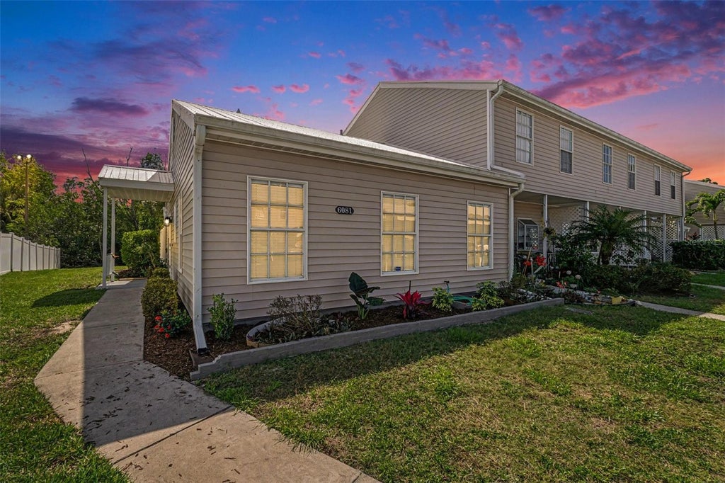 Photo of 6081 Lake Front Drive, Fort Myers, FL 33908 (MLS # TB8559570)