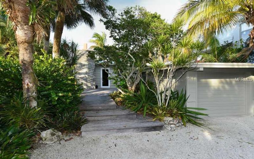 Rare Gulf Front Oasis on Casey Key. Bungalow house that is both charming and sophisticated forward of Coastal Construction Control Line. Extensive tropicals and botanicals envelope this property. Separate gazebo, open pool and covered patio. No bayside easements. Build a fabulous home or enjoy the beauty of Old Florida. 100 feet on gulf.