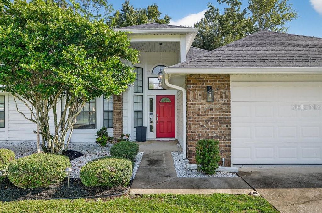 Photo of 1941 Spruce Creek Landing, Port Orange, FL 32128 (MLS # NS1086156)