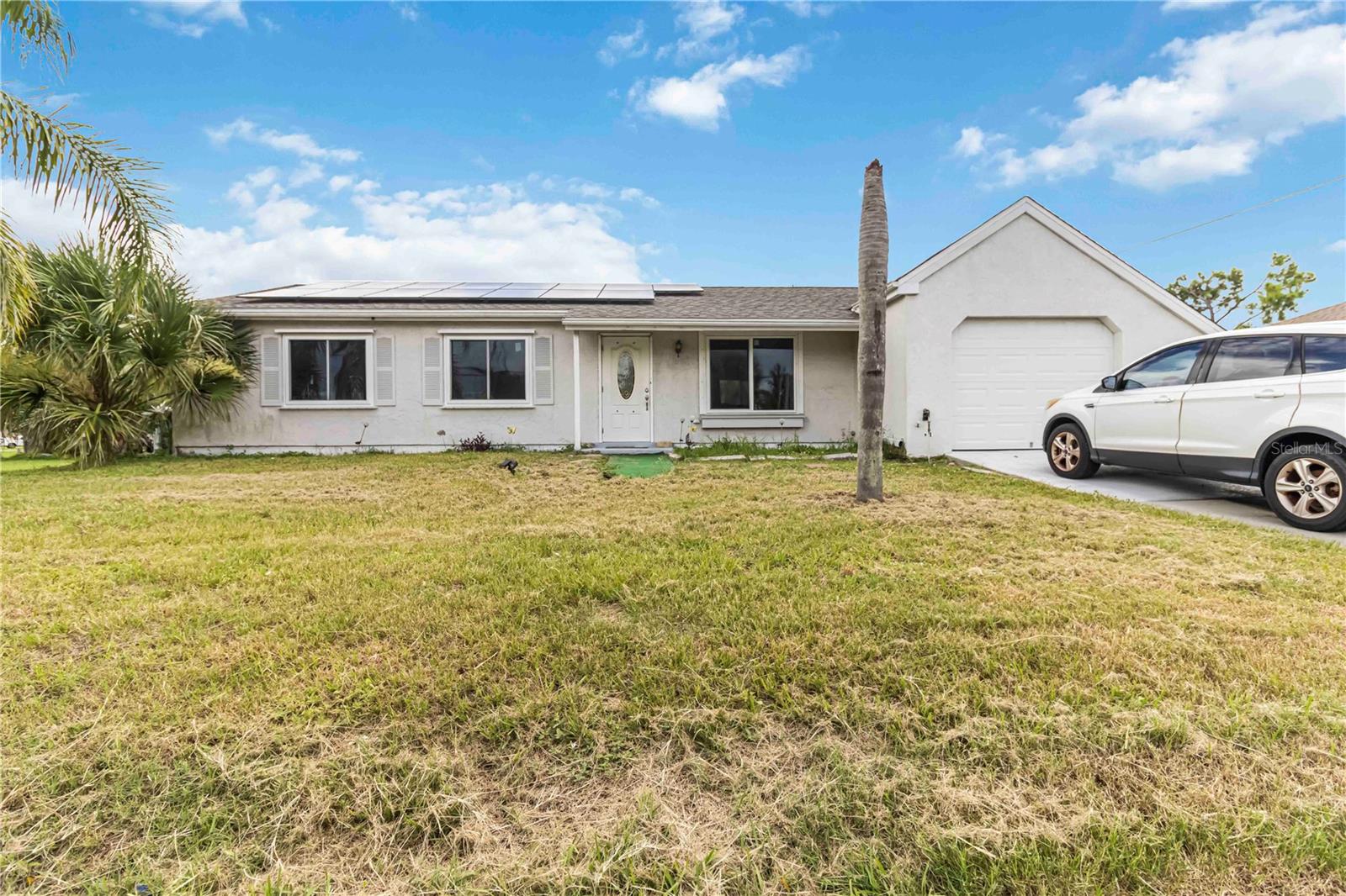Don’t miss this must-see home with an updated kitchen, sitting on a spacious oversized lot. Located close to parks, beaches, boating, fishing, and swimming—this is the perfect spot for enjoying Florida living. With no HOA and no CDD fees, you’ll have the freedom to truly make this home your own. Plus, energy-saving solar panels help keep your electric bills low!