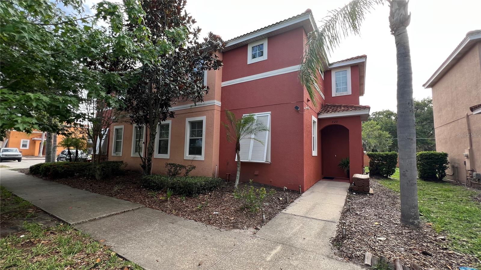 Beautiful furnished turnkey townhome 4 bedrooms/ 3 bathrooms with private screened in pool located in BELLAVIDA RESORT near Hwy. 192. NO CARPET - ALL THE FLOOR WAS RENOVATED WITH A LUXURIUS VYNIL. NEW AC 2025. First floor has a large living room, open kitchen, guest bedroom with a full bathroom and laundry. The master suite is located upstairs along with 2 additional bedrooms and a shared family bathroom. It is a Gated Community Resort with clubhouse, game room, business center, movie theater, gym, heated pool and spa, basketball half court, sand volleyball court and playground. JUST MINUTES AWAY FROM DISNEY WORLD PARKS, WALMART, GREAT OUTLET and SHOPPING. SHORT TERM RENTALS ARE ALLOWED.