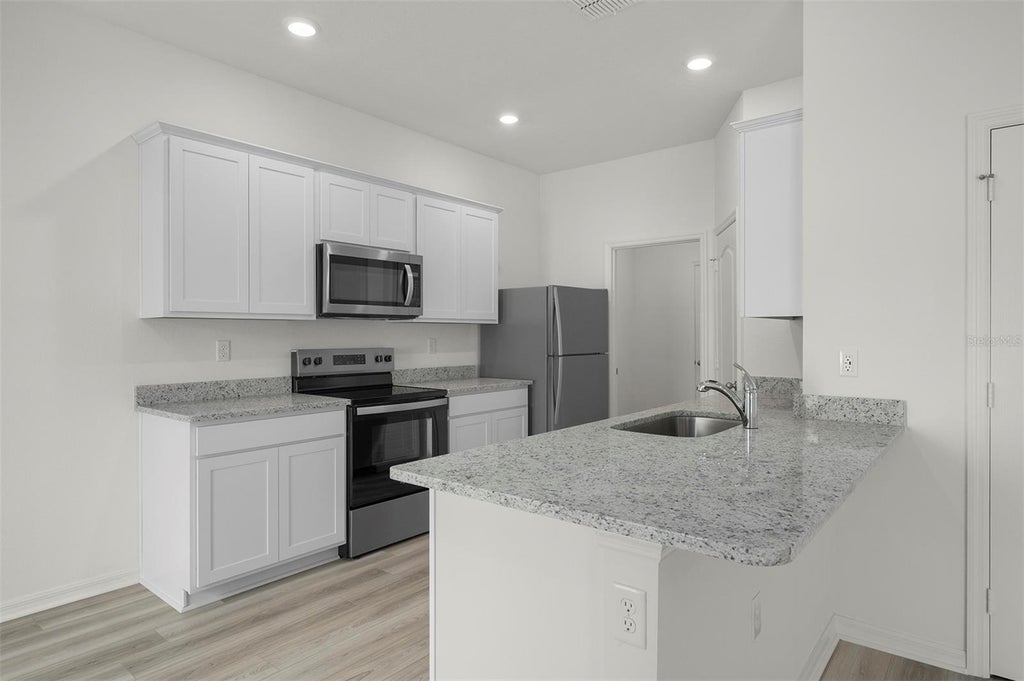 Photo of 13238 Tula Loop, Astatula, FL 34705 (MLS # TB8550957)