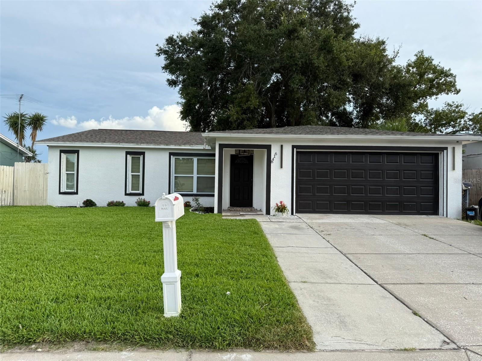 Welcome to this Beautiful completely Remodeled 3-bedrooms, 2 bathrooms, 2 car garage home. HIGHLIGHTS include NEW porcelain flooring throughout the entire house installed in 2023. NEW roof installed in 2023 along with A/C Unit, ducts system, Water Heater, doors, windows, light fixtures, kitchen cabinets, granite counter tops. The Appliances are 2 years old. NEW plumbing and electric panel installed in 2023 all of it was done with permits. NO FLOOD ZONE, NO HOA. Come and see this beauty. Schedule your showing Today!!!