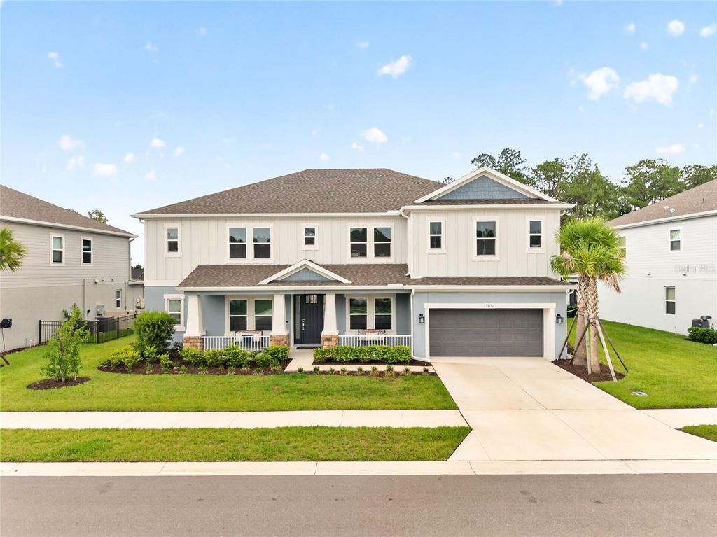 Photo of 33751 Landsman Loop, Wesley Chapel, FL 33543 (MLS # TB8525006)