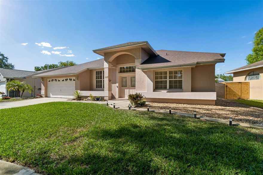 Meticulously maintained pool home in desirable Brittany Park offering a spacious open floor plan with soaring cathedral ceilings throughout. This home features a formal living room, formal dining room, and a large family room, all flowing seamlessly into an expansive kitchen with abundant cabinetry, a tile backsplash, and a large coffee bar—perfect for entertaining. No carpet throughout for a clean, modern feel.

The primary suite includes a large walk-in closet and convenient access to the pool area. Enjoy true Florida living with multiple access points to the pool from the primary bedroom, kitchen, guest bathroom, and indoor laundry room.

The pool been remarcited and features a newly redone birdcage screen enclosure, new outdoor ceiling fans, and a cool-coated pool deck for added comfort. The backyard is fully fenced and includes low-maintenance astro turf, along with concrete landscape curbing throughout.

Additional upgrades include a new roof (February 2026), AC (2017), and all-new exterior paint. Located in a community with no CDD fees and no flood insurance required.

Ideally situated in Tarpon Springs, just minutes from the historic downtown, sponge docks, dining, and waterfront attractions, with convenient access to Tampa International Airport—making travel and commuting a breeze.

Pride of ownership shows in every detail—this home is truly move-in ready.