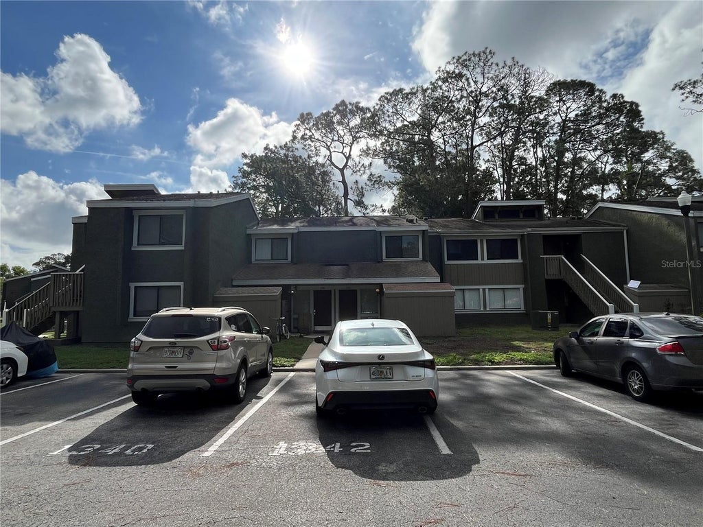 Photo of 6142 Peregrine Avenue #13D, Orlando, FL 32819 (MLS # O6413012)