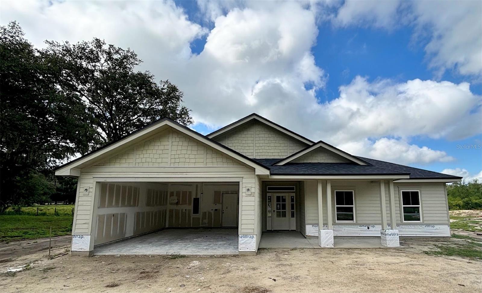Under Construction. Be the First to Call This Home! This beautiful new construction home sits in the heart of Melrose, FL. This home offers the perfect opportunity to secure your place in a brand-new residence before it's complete. Featuring 4 bedrooms, 2.5 bathrooms. With 1,981 h/c sq ft. Enjoy modern craftsmanship, open-concept layout, and thoughtful design throughout. With construction well underway, now's your chance to customize select finishes and truly make it your own (depending on the build timeline.) Set on a spacious half-acre lot in a peaceful setting, you'll love the blend of country living with easy access to local shops, lakes, and dining. Don't miss this rare chance to own new in the charming Melrose community and in Florida's best lake region!