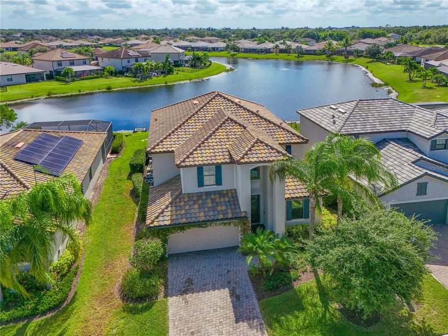 Price Reduction! You’ll fall in love with this spacious home that offers room for everyone! The flexible layout includes a comfortable guest suite with a full bath downstairs and a large bonus room perfect for a playroom, media space, or home office. The bright, open kitchen features white cabinets with crown molding, granite counters, and stainless steel appliances—ideal for family meals and entertaining. Step outside to your private backyard retreat overlooking a peaceful pond with beautiful southern views. Enjoy year-round fun in the heated pool and spa, surrounded by pavers and a screened lanai. Inside, new luxury vinyl plank flooring adds warmth and style to the upstairs, stairs, and guest suite, while large diagonal tile flows through the main living areas. Copperleaf is centrally located just off St Rd 64, east of I-75, and is close to Costco and all of the new retail and restaurants surrounding it. This home is move-in ready and waiting for your family to make lasting memories!