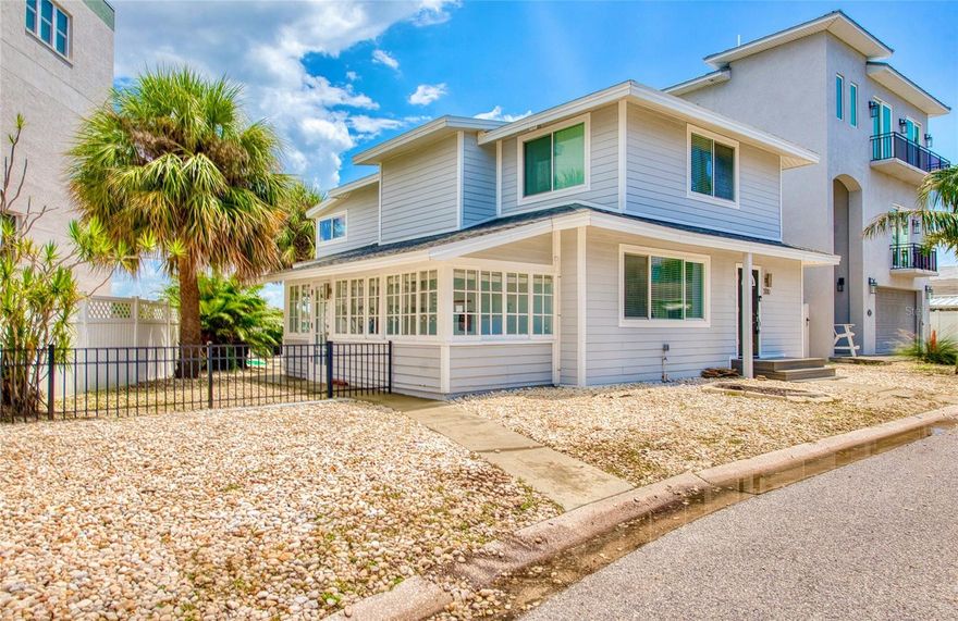 CALLING ALL BEACH LOVERS!!!  Have you ever wanted to live so close to the beach that you can open the front door and walk under 5 minutes to place your toes in the sand??  Then, this home is for you!  Located in the southern tip of Treasure Island, enjoy the backyard gorgeous intracoastal views along with a close proximity to Sunset Beach right on the Gulf of America, only steps away from the home!  Get your piece of beach paradise in this two-story waterfront home with 3 bedrooms with 3 en-suite full bathrooms and an additional half bathroom on the main level.  The downstairs level includes an open concept FULLY REMODELED KITCHEN with STAINLESS STEEL APPLIANCES, QUARTZ COUNTERTOPS, BREAKFAST BAR, and a WATERFRONT VIEW also shared with the living and dining room areas.  Entertainment is easy and fun by opening the sliding glass doors in the living room which lead to the fenced outdoor living area with a wooden deck and PRIVATE DOCK for fishing. A guest bedroom with an en-suite bathroom is on the main level along with the half bathroom.  Upstairs are two additional bedrooms with en-suite bathrooms. The primary bedroom has a perfect view of the intracoastal waters with it’s own private balcony, the perfect spot to soak in the sunrises, or enjoy a book in the seating nook by the windows.  Across from the primary bedroom is the other upstairs bedroom which includes a walk-in closet for plenty of storage.  Laundry day is made easy with an upstairs laundry room for convenience.  Downstairs off of the kitchen is a bonus room for extra storage, exercise, or your own creative area.  The AC UNIT AND MINI SPLITS WERE NEWLY INSTALLED in July 2025 and the roof is approximately 7 years old.  Use this home as a primary residence, vacation spot, or investment with both short and long term rentals.  All furnishings and decor can be included, so it’s turn-key for the new owner all with a convenient location near dining, entertainment, St. Pete Beach, Clearwater, John’s Pass, Blind Pass, and other Pinellas County beaches.