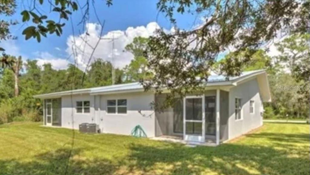 Photo of 115 Glenn Avenue NW, Lake Placid, FL 33852 (MLS # L4957900)