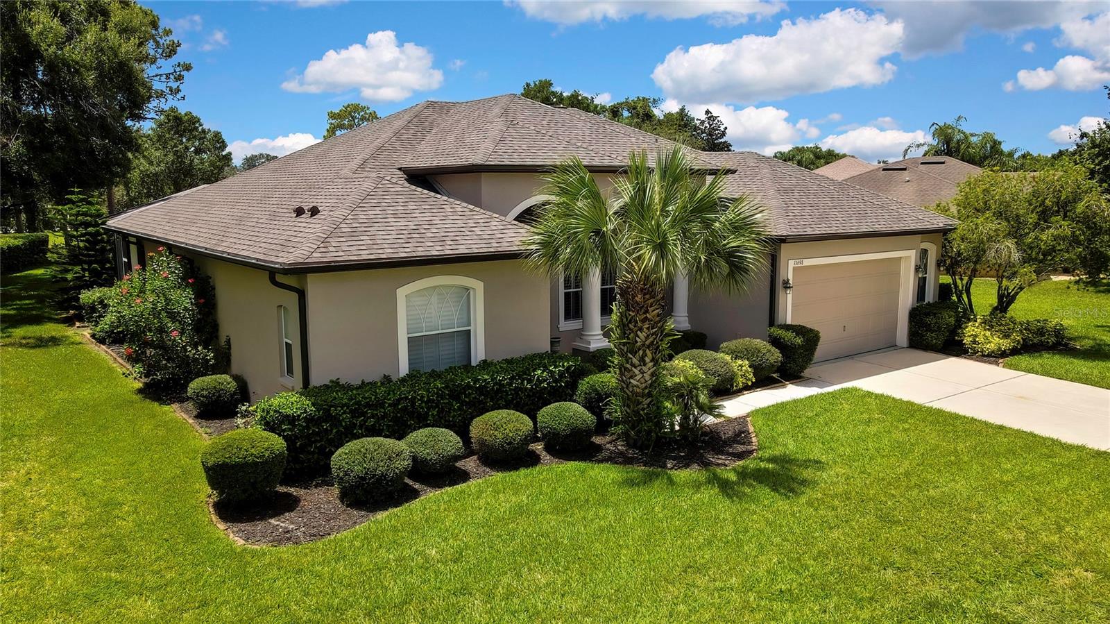 Luxurious, Spacious home with a brand-new 2025 roof in a Prime Location of Somerton Place in the Villages of Avalon. Built by custom builder Lexington this 3-bedroom, 3 baths, oversized 2 car garage with private inground pool, screened in, sits on just over a 1/3 acre with no rear neighbors, and no build behind! Located in the lovely Villages of Avalon community with very low homeowner association fees, under $67. a month and NO CDD fees. An absolute must-see home. As you enter the double door grand entrance you will be greeted with gorgeous hardwood floors and a flowing layout floor plan. A nice size foyer, dining room and living room that offers tray ceiling and a view of the pool and private backyard. Tucked away in the back of the home is a huge family room, kitchen and dinette area overlooking the pool lanai. Throughout the home are Plantation Shutters on pocket sliders and windows that allow just the right amount of sunlight in and offers privacy. The well laid out kitchen boasts plenty of granite counters, tile backsplash, 42-inch cabinets, stainless steel appliances, eat-in dinette area, and a breakfast bar that’s perfect for gatherings. Generous primary suite with tray ceilings, double walk-in closets, and access to the pool. Primary bath updated, new vanities with granite counters, new double sinks and faucets, soaker tub, separate tile shower. The 2nd and 3rd bathrooms were also recently updated with new vanity and offer granite counters, new sink, and faucets. Relax and enjoy the beauty and peacefulness by the Diamond Brite pool with no rear neighbors or enjoy a cookout on your enclosed screened lanai. The grass will be lush and green as you have a well for irrigation. Other amazing features include recent interior and exterior paint, resurface floor in garage; plantation shutters; and beautifully landscaped. Conveniently located close to Suncoast parkway, restaurants, shopping, schools, and hospitals. Sidewalks throughout the community and bike path is a short distance away. Community clubhouse, pool and park a short bike ride. Minutes to the Suncoast parkway for quick access to the airport, Tampa, Clearwater and St. Pete Beaches (Ranked in the top 5 Beaches in the US), also close to the famous Tarpon Springs Sponge Docks.