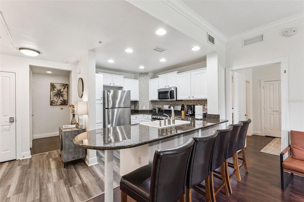 Photo of 7703 Heritage Crossing Way #201, Reunion, FL 34747 (MLS # O6343964)