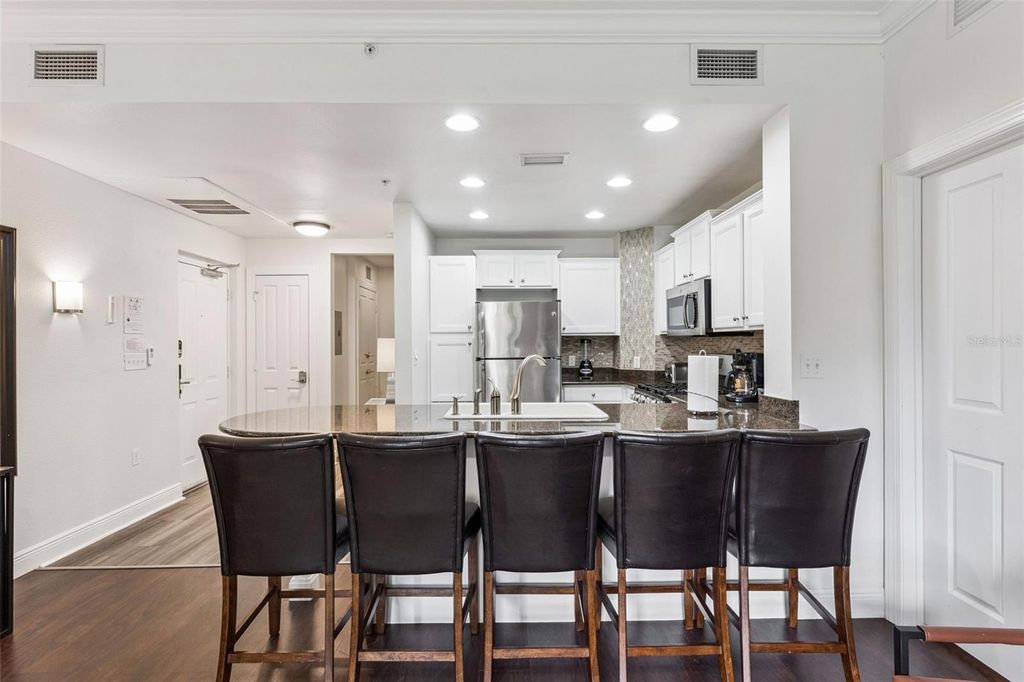 Photo of 7703 Heritage Crossing Way #201, Reunion, FL 34747 (MLS # O6343964)