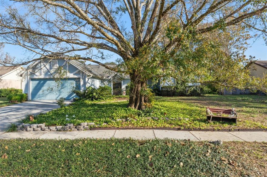 One or more photo(s) has been virtually staged. Welcome home to this well-appointed 4-bedroom, 2-bath residence featuring a desirable split floorplan and bright, open living spaces. Neutral flooring flows throughout, complemented by abundant natural light from oversized windows. The great room showcases vaulted ceilings with defined living and dining areas, creating an airy and welcoming atmosphere. A large kitchen anchors the home with an island, dinette area, and convenient access to the laundry room and two-car garage. The spacious primary suite offers a peaceful retreat with a generous walk-in closet, double-sink vanity, and an oversized tile shower. All three secondary bedrooms are good size with large closets and windows that let in great natural light. The secondary bathroom includes a shower/tub combo and single-sink vanity, ideal for family or guests. Sliding glass doors in the dining space lead to a spacious covered and screened patio, perfect for relaxing or entertaining. Enjoy a well-manicured, beautifully landscaped, wood-fenced yard, complete with a shed and plenty of room for a pool or playset. Ideally located in the heart of Oviedo, this home is minutes from top-rated schools spanning pre-K through doctorate-level education, along with dining, shopping, and entertainment options. With easy access to SR 417, commuting is a breeze. This home perfectly blends comfort, space, and an unbeatable location.