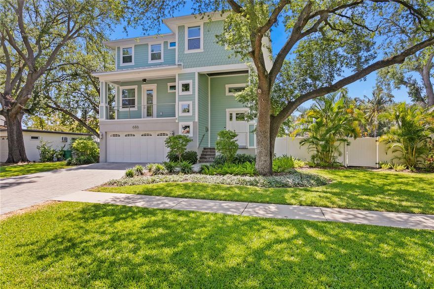 Newer Davis Islands Waterfront Home situated on over a 1/4 Acre Canal Front Lot, leading out to Tampa Bay! The home has a very functional layout: 4 Bedrooms, 4 Full Bathrooms, 1 powder bathroom, Office + Bonus Room/Loft. The extraordinary outdoor space thoughtfully crafted includes a saltwater heated pool/spa/sunshelf w/sheer waterfalls that pour out of the fire feature, a putting green, an outdoor kitchen as well as a fully turfed oversized lawn. The entire 1st floor is garage (room for 5 cars) with an Elevator to the 2nd and 3rd levels. The 2nd floor holds an open great room/kitchen/dining room layout w/Nano doors leading out to a covered deck. This level also includes a guest bedroom suite, office & powder bathroom. The primary suite encompasses the entire width of the 3rd level with its own private balcony. The additional 2 bedroom suites and loft/bonus space round out the 3rd level. A whole house generator, smart house automation and new AC units were recently added. Davis Islands is conveniently located just beyond Downtown Tampa, Channelside, Sparkman's Wharf and Harbour Island. Also, just a quick golf cart ride away from Hyde Park Village. DI is also home to Davis Island's Yacht Club, a small sandy beach, a large waterfront park, an array of shops & restaurants, a playground, tennis courts, baseball fields, public pool (newly redesigned with "splash area"), dog parks, boat ramp and small private pilot airport (FBO). Gorrie/Wilson/Plant school district.