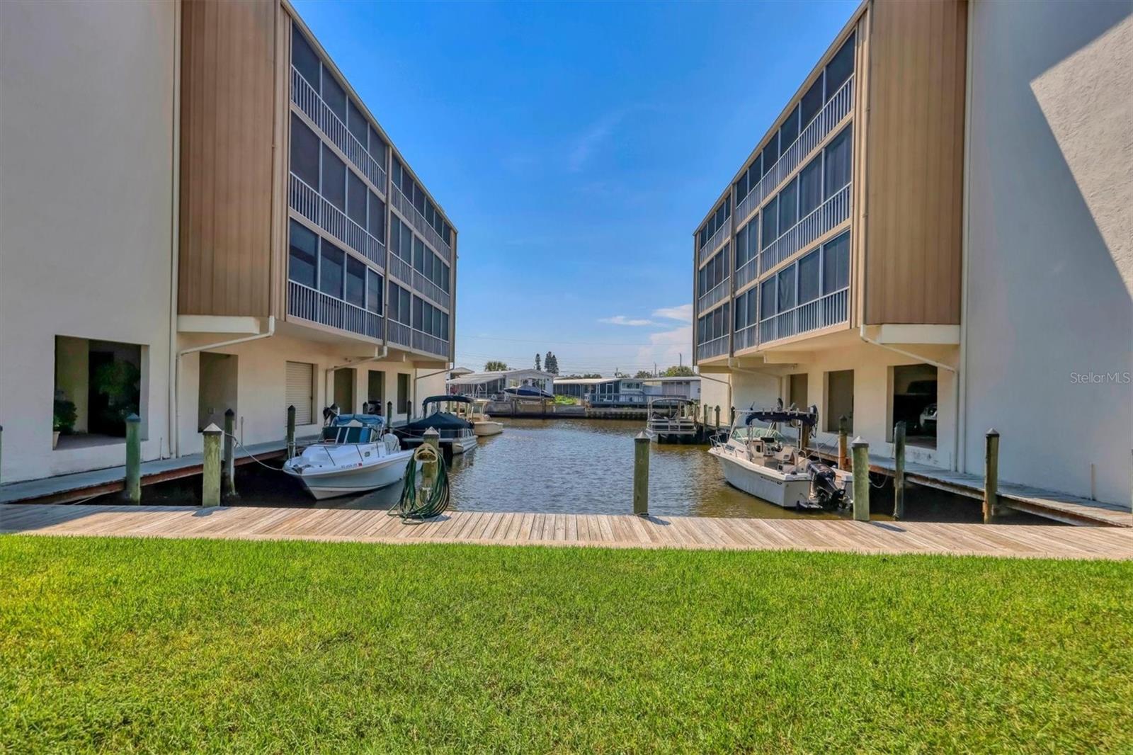Turnkey Furnished unit — This 2-bedroom, 2 Bathroom Condo shows like a MODEL HOME! A Boater’s Dream on the Water!
You won’t find a better value in Manatee or Sarasota County to dock your boat right outside your condo! Assigned dock space is available.
— an incredible deal.
This completely modernized waterfront condo offers direct access with no bridges to Sarasota Bay and the Intracoastal Waterway. The owner spared no expense in creating a stunning, move-in-ready home. The entire unit was fully remodeled down to the studs, featuring new plumbing and electric wiring, outlets, and lighting fixtures.
The electrical panel was relocated which allowed for an expansive island—perfect for entertaining friends and family.
The kitchen is a chef's dream, it features hardwood cabinets, quartzite countertops with a beautiful leathered finish, pull-out drawers, stylish wet bar, and top-of-the-line stainless steel appliances, oversized kitchen sink with commercial faucet.
The spacious Master Bedroom suite includes a walk-in closet, and sliding glass doors leading to your private lanai with water views.
The en-suite bathroom showcases a walk-in shower and modern finishes and floor to ceiling porcelain tile. The second bedroom is versatile, featuring a cabinet bed for use as both an office and a guest room. The hall bathroom boasts a sleek floor to ceiling porcelain tiled design and a modern bathtub.
Enjoy the outdoors from your 35-foot-long lanai which features tinted vinyl panels to block out the rain and wind. This unit has tons interior storage with additional storage on the lanai and a first floor storage locker.
Additional updates include a new water heater (installed in 2021) and HVAC system (installed in 2019). Elegant 24" x 48" high-end porcelain tile flows throughout the home.
Laundry rooms are conveniently located on every floor. Elevators make
it easy to access the unit and garage parking is available for an extra monthly fee.
and there is ample free outdoor parking.
Located 3 miles from to Sarasota International Airport, and minutes from University Town center Mall, Restaurants, and our Beautiful Florida's beaches .
Located on a short canal ride straight to the wide-open waters of Sarasota Bay — where you can see the Ringling Bridge as you approach! In just 10–15 minutes by boat, you’ll find some of Sarasota’s
most popular waterfront dining spots, including Marina Jack’s, The Salty Dog,
and Dry Dock. Headnorth to the crystal-clear waters of Jewfish Key for a
perfect sandbar day, or continue on to Cortez for live music and fresh seafood at
local favorites like The Swordfish Grill, Cortez Kitchen, or Star Fish
Company.
For the avid angler, this location provides unbeatable Gulf access—head north 10 minutes through New Pass, or south 15 minutes to
Longboat Pass for a direct route to open waters. Sarabay Coves truly offers the most convenient, centralized boating access in Sarasota and Manatee Counties.
The HOA fees include internet, cable, water, sewer, trash, pool,
jacuzzi, clubhouse, tennis courts, building insurance, flood
insurance, common area liability insurance, and professional
management.
Great Investment property! Rent 12 times a year 30 day minimum and
pets are welcome. Sarabay Cove is truly a Hidden Gem waterfront
Community!
(Please note: photos of amenities were taken before storm damage;
repairs to the pool, clubhouse, and tennis courts are currently in
progress.