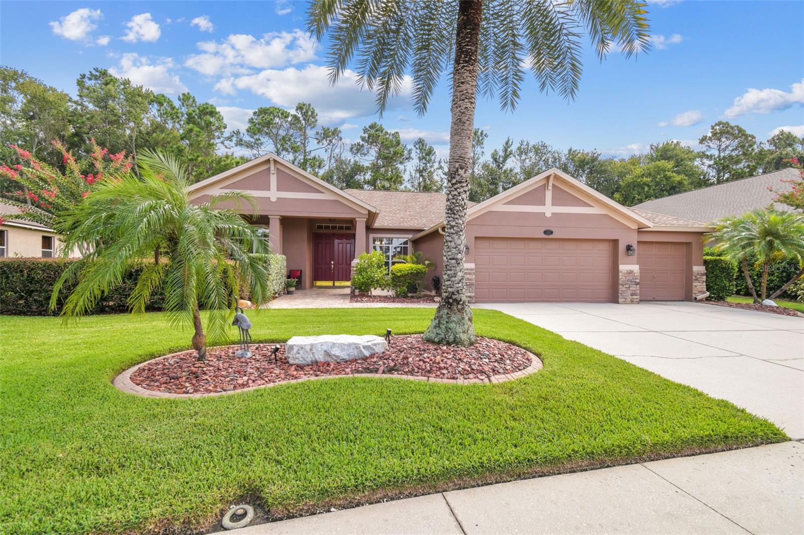 Privacy abounds in this well maintained home located in the beautiful gated community of Ivy Lake Estates. Featuring 4 bedrooms plus office, 3 baths and a 3 car garage, this thoughtfully designed home offers a split bedroom plan for privacy and an open floor plan with loads of natural light. The chef in the family will enjoy the large open kitchen featuring warm wood cabinets, granite counters, gas stove with griddle, stainless appliances and a work island giving extra storage as well as prep or serving space. The kitchen is open to the large, bright family room that overlooks the pool. Built-in cabinets offer a lovely design element to the room plus loads of storage. The bedroom is a 3-way split plan with main bedroom on 1 side of the house, 2 bedrooms and 1 bath off the main hallway and 1 bedroom and 1 bath at the back of the house that works well for guests or as an in-law suite. The bright, oversized main bedroom offers plenty of room for all your furniture plus a small sitting area. The main bath features separate vanities; each with warm wood cabinets and solid surface countertops, sunken garden tub with tile surround and separate walk-in shower with tile walls and glass surround. 2 walk-in closets complete this true main suite. After a hard day’s work, retreat to your totally private backyard for cocktails and a cookout at your outdoor kitchen and a swim in your refreshing, sparkling pool. This screened pool features a 4HP Badu Swimjet and is heated for enjoyment in the cooler months and is saltwater for easy maintenance. Enjoy nature and your privacy with your peaceful conservation backyard. No rear neighbors! Recent updates include: roof 2021, ac 2021, gas water heater 2022, water softener 2023, pool cage rescreen 2024. Sellers are also leaving a natural gas generator with a quick-connect system for easy start-up after power loss. Home systems including thermostat, alarm, sprinkler system and garage door are all wi-fi for control from anywhere. Come take a look at this lovely, well maintained home and you’ll see there’s nothing to do but move in!