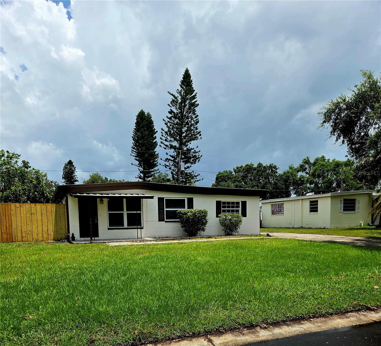 Remodeled 3BR Block Home in Crest Ridge – Large Lot, Bonus Room!
Beautifully remodeled 3-bedroom, 1-bath block home in the highly desirable Crest Ridge neighborhood of Largo. Updated kitchen with new cabinets and appliances, remodeled bath with new tile and vanity, and durable vinyl plank flooring throughout. Spacious family room with separate entrance offers flexibility—perfect for entertaining or converting to a 4th bedroom. Interior laundry/utility room with additional entry door. All bedrooms feature new ceiling fans. Fresh exterior paint, 13-year-old metal roof, newly paved front porch and sidewalk. Oversized lot offers space for additions, pool, or RV/boat parking. Located near Bardmoor shopping and the new Bryan Dairy interstate ramps for easy asccess to St Pete or Tampa. Move-in ready!