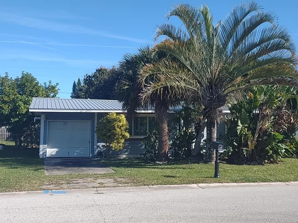 Photo of 227 Woodland Avenue, Cocoa Beach, FL 32931 (MLS # O6409812)