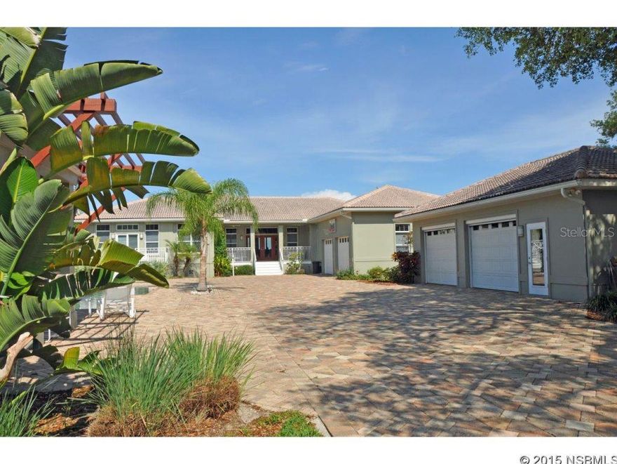 Intracoastal 1 acre gated compound built in 2000 & further detailed in 2005 & later, including the installation of solid Oak floors, expansive impact glass sliding doors opening to expansive screen enclosed outdoor area, fabulous 2 lane lap pool & gated entry. Extensive garage space with oversized attached 2 car garage & oversized detached 2 car air conditioned garage; this additional space is ideal for a car collector, home office or conversion to separate in-law quarters. Intracoastal deepwater dock with boat house & lift. Spacious kitchen has lots of windows & granite counters + separate butlerâs pantry area. Master suite has dual custom closets, glass block bath & great Intracoastal views with sliders to screened deck. Three of the four bdrms open to covered or screened porches. The fourth bdrm has custom-built Maple roll-back library wall to reveal queen size Murphy bed. Office has closet & could be a 5th bdrm if needed. Volume ceilings throughout. All windows are double-paned. There are storm shutters for all windows & doors. All buildings are masonry construction with the exception of small portion section of south guest bdrm that was added in 2005. The main home living area is on one level & is nicely elevated to capture Intracoastal views & breezes. Fully fenced & landscaped yard with lawns both front & rear.  Citrus trees, including orange, lemon & lime. Salt water pool.  Well, pump & sprinkler system for yard care.  Washer/dryer new 2013, dishwasher 2015.  This is a one-of-a-kind property. See to appreciate! ;Water: City