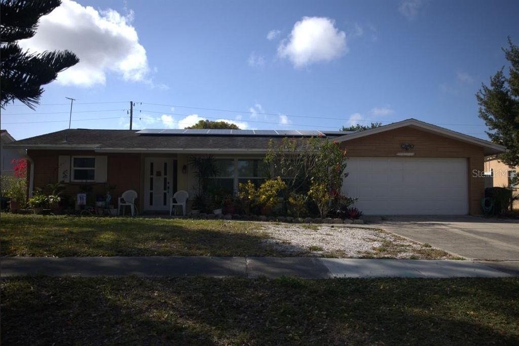 Photo of 1158 Overcash Drive, Dunedin, FL 34698 (MLS # TB8491799)