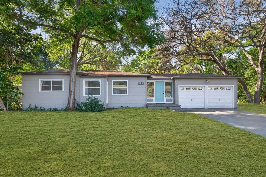 One or more photo(s) has been virtually staged. Welcome to 1623 Dartmouth St in Clearwater, FL—an inviting non-flood zone residence where architectural charm meets modern sophistication in a setting that truly lives beyond the walls of the home. From the moment you enter, you’re greeted by an abundance of natural light that pours effortlessly through the interiors, illuminating rich hardwood floors and striking coffered ceilings that add a level of craftsmanship and depth seldom found at this price point. The updated kitchen is both stylish and functional, thoughtfully appointed with stainless steel appliances, clean lines, and a seamless flow ideal for both intimate evenings and effortless entertaining. Recessed LED lighting enhances the home’s refined aesthetic, creating a warm yet elevated ambiance throughout. Offering 3 bedrooms and 1.5 bathrooms, the layout is designed for comfort and versatility, while the living area is anchored by a charming wood-burning fireplace—providing a cozy focal point that invites relaxation and connection. Set on an expansive homesite (A TRUE DOUBLE LOT) with an exceptional sense of openness and flexibility, the property offers ample room to accommodate boat or RV parking with ease—an increasingly rare and highly desirable feature. Whether you envision future expansion, a custom outdoor retreat, or simply enjoying the freedom of additional space, this setting provides the opportunity to do so without compromise. Adding to its appeal, the home’s proximity to Crest Lake Park offers a lifestyle element that is truly unmatched—perfect for peaceful morning strolls, evening walks, and enjoying the natural beauty just moments from your front door. This is more than a home—it’s a thoughtfully curated living experience where charm, space, and location converge to create something truly special.