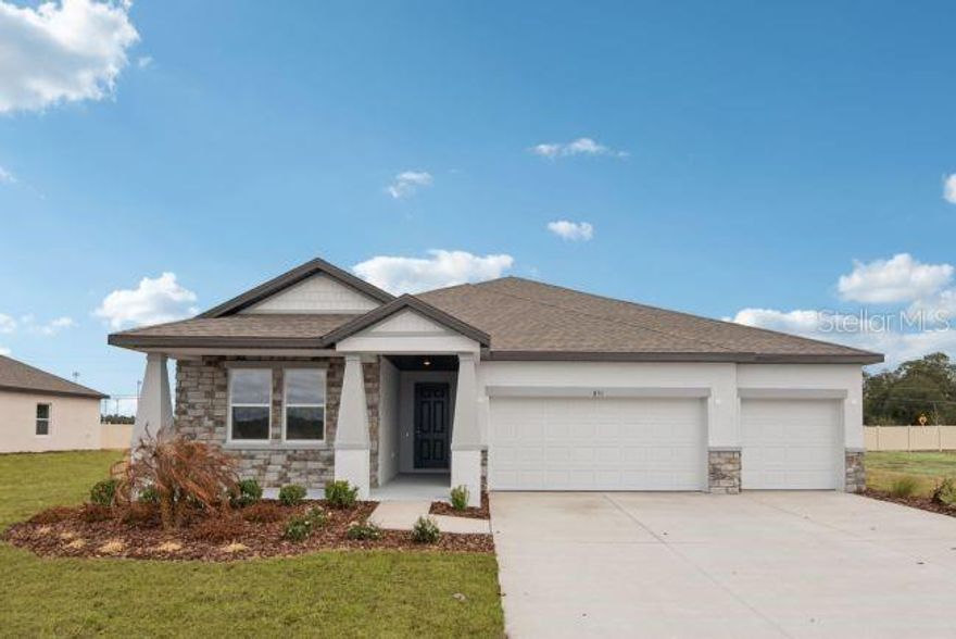 Pre-Construction. To be built. Discover The Naples, an exceptional single-story home perfectly positioned on a landscaped greenbelt homesite with no rear neighbors in Sugarmill Woods, a quiet cul-de-sac community surrounded by tree-lined streets, lush greenery, and charming Villages that create a peaceful atmosphere. Located near Florida’s Big Bend, Homosassa is known for its crystal-clear springs, scenic state parks, nearby beaches, boating, fishing, and endless outdoor recreation.

From the moment you arrive, the stone-accent exterior, irrigation, manicured landscaping, flood lights, and impressive 8' glass inlay front door create standout curb appeal. Inside, 10' ceilings, custom interior paint, crown molding, deluxe interior trim, lever door hardware, and upgraded lighting throughout elevate the home’s elegant design. The spacious great room features an impressive 11' ceiling with additional lighting and seamlessly connects to the extended lanai with an acrylic finish through two double-panel glass patio doors, creating a bright and inviting indoor-outdoor living experience.

A private den with double French doors and additional lighting provides the perfect space for a home office, library, or flex room. The chef-inspired kitchen showcases quartz countertops, soft-close solid wood cabinetry, a subway tile backsplash, stainless steel appliances, an ENERGY STAR French door refrigerator, a large center island, walk-in pantry, and a complete laundry package that includes a washer and dryer for added convenience. EVP flooring flows throughout the main living areas, while ceramic tile showers add a polished finish to the bathrooms.

The luxurious primary suite is designed for comfort and relaxation with additional lighting, split vanities, a spacious walk-in closet, linen closet, and an oversized walk-in shower with ceramic tile surround. The guest bath features a glass enclosure on the walk-in shower, while brushed nickel faucets add a refined touch throughout the home. Additional upgrades include an appliance outlet and thoughtful enhancements designed for both style and functionality.

Smart home features such as a Ring Video Doorbell, Smart Thermostat, Keyless Entry Smart Door Lock, and Deako Switches provide modern convenience and peace of mind in this beautifully upgraded home.