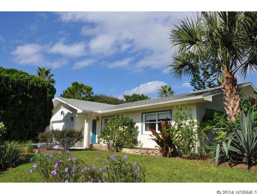 Immaculate beachside pool home on over 1/3 acre!  Tranquil private garden areas surround this 3 bdrm 2 bath home with 2 car garage.  Beautifully renovated eat-in kitchen with stainless appliances.  Fireplace in family room.  Large living, dining & utility rooms.  Natural gas for stove, fireplace & dryer.  Tile, wood & laminate flooring.   Utility room doubles as craft room. Concrete construction, immaculate condition.  This nicely elevated property is double the size of most neighboring parcels.  Plenty of room for expansion.   Well water for irrigation system.   Extremely private fenced yard.  Very close to car free beach access.  See to appreciate. ;Water: City