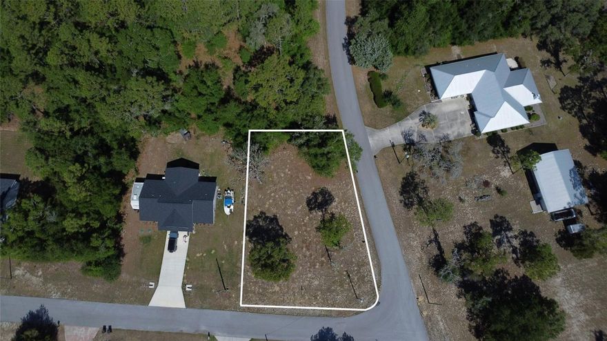 Discover the opportunity to own a 0.27-acre partially cleared corner lot in the growing community of Williston Highlands Golf & Country Club Estates. With added road frontage on two sides, this corner parcel offers increased flexibility for access, layout, and future development making it an excellent option for a homesite or investment property.

The lot is partially cleared, helping save time and cost as you prepare to build. Zoned for residential use (buyer to verify), it may be suitable for site-built or manufactured homes, offering versatility to fit a variety of needs.

Located in Levy County, this area is known for its peaceful, rural setting while still offering convenient access to nearby towns and amenities. Just minutes from downtown Williston, you’ll find local dining, shopping, and everyday essentials, while Ocala is a short drive away for expanded retail, medical facilities, and entertainment.

Outdoor enthusiasts will appreciate the close proximity to Goethe State Forest for horseback riding and trails, the crystal-clear waters of the Rainbow River for kayaking and swimming, and the World Equestrian Center for year-round events, dining, and entertainment. The surrounding area continues to grow, making this a great opportunity to secure land in an up-and-coming location.

With no HOA, you’ll enjoy the freedom to build and use the property with fewer restrictions. Whether you’re looking to build your primary residence, place a manufactured home, or hold as a long-term investment, this property offers flexibility, convenience, and long-term potential.
