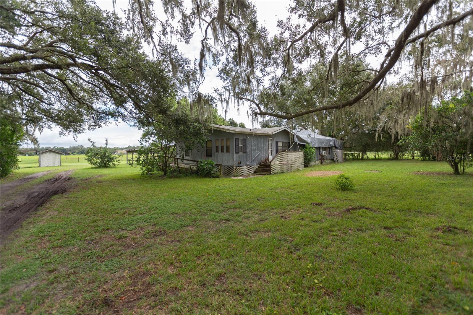 Looking for space, privacy, and a peaceful lifestyle? This 4.55-acre property offers the perfect opportunity to create your dream home in the country. Tucked away from the hustle and bustle, it’s ideal for those who want room to garden, raise animals, or simply enjoy the quiet beauty of nature. The home does need repairs and updates, making it a great choice for buyers with a vision whether you’re a renovator, investor, or someone ready to put in sweat equity. With the right touch, you can transform this property into a charming country retreat. Enjoy the best of rural living while still being within reach of Bushnell. Properties with this much land and potential don’t come around often don’t miss your chance to make it yours!