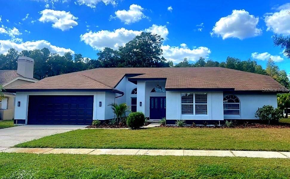 **STUNNING WATERFRONT REMODEL!** If you've been searching for your "DREAM HOME," look no further—this is it! This beautifully updated 2025 home has everything you could want. Nestled in one of the most picturesque neighborhoods along the East Lake corridor, Woodfield is a fantastic community with contemporary Florida homes surrounded by mature trees and serene ponds. Your new home boasts incredible curb appeal with a freshly painted exterior, designer lighting, and vibrant landscaping. Step inside, and it only gets better! From the moment you enter, you'll be greeted with breathtaking waterfront views. The spacious open floor plan features triple sliders that showcase the scenic vista, while high ceilings enhance the airy and open feel. Professionally staged to display the home's maximum potential! The dining room includes a stylish accent wall, and the family room is centered around a custom stone fireplace. Windows throughout bring the outdoors in, flooding the interior with natural light. The entire home has been freshly painted and textured, and the brand-new "wood" vinyl flooring is complemented by high baseboards. The kitchen is a showstopper with a dinette area, a new breakfast bar, stainless steel appliances, sleek soft-close cabinetry, quartz countertops, and a stunning tiled backsplash. All three bathrooms have been upgraded with resort-style finishes, including an incredible glass walk-in shower in the master bathroom. The primary master suite offers a luxurious ensuite and a walk-in closet, while the versatile fourth bedroom can be used as a guest room or home office. Good-sized laundry room with a frosted-glass entry door, cabinetry, and granite counter! 2-car garage with painted garage floor! But the real star might just be the outdoor pool area! The expansive pool deck features a brand-new vinyl ceiling on the covered patio, new brick pavers, and a vaulted screen enclosure. The million-dollar view of the pond and conservation area provides a tranquil setting you'll never want to leave. This home truly has it all!
