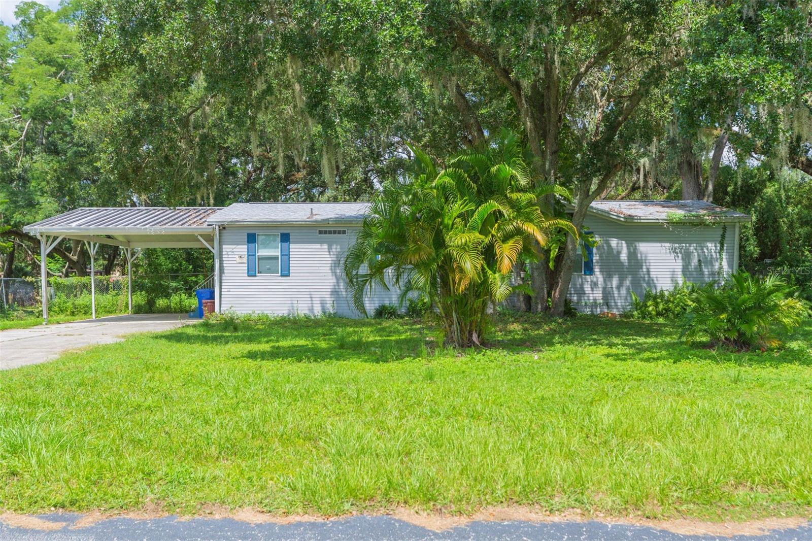 Welcome to beautiful, quiet country living. At just over a half acre, there is plenty of room for your RV, work trucks or even a pool! Home is in excellent condition featuring laminate floors throughout. AC is new (2024) and the hot water heater is only 2 years old (2023). There is a beautiful fireplace in the living room and a formal dining room with a beautiful light fixture. The kitchen is very large and can accommodate a dining room table. The master bathroom is stunning with a round bathtub and a shower stall. The surrounding mirrors are lovely and makes the room bright and cheerful. Both the well and septic have been updated in the past 6 years. In addition, the home is tied down as per FHA regulations. The large yard is fenced in with a gate to access Bowles Road which would be perfect for your large equipment entrance. Property also has a huge storage shed that would be great as a workshop or additional living space. Located in a quiet deed-restricted community.