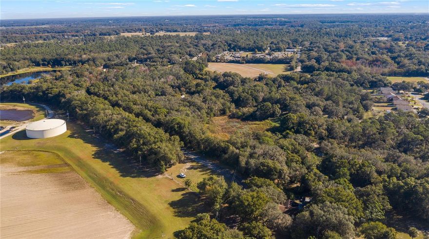This property offers a generous 24+ acres featuring a blend of residential and Mixed Commercial Residential zoning. With the potential for up to 12 dwellings per acre, the opportunities are extensive. Options include constructing 20 duplexes, 20 single-family homes, or 40 townhouses, or a combination of these along the county-maintained road frontage. Alternatively, you may explore alternative ventures such as self-storage, mixed-use developments, apartments, or a combination of townhouses, duplexes, and single-family homes. The choice is yours to build your dream home or pursue a variety of development possibilities. City water and sewer connections are readily available. This offering encompasses four parcels with Alt Key numbers 1193770, 1193532, 3862860. Please be considerate and refrain from disturbing 1029 Palmetto Street, as it is not part of this listing. The potential here is virtually limitless. Seller will sell the MCR 17.60 acres seperatly.