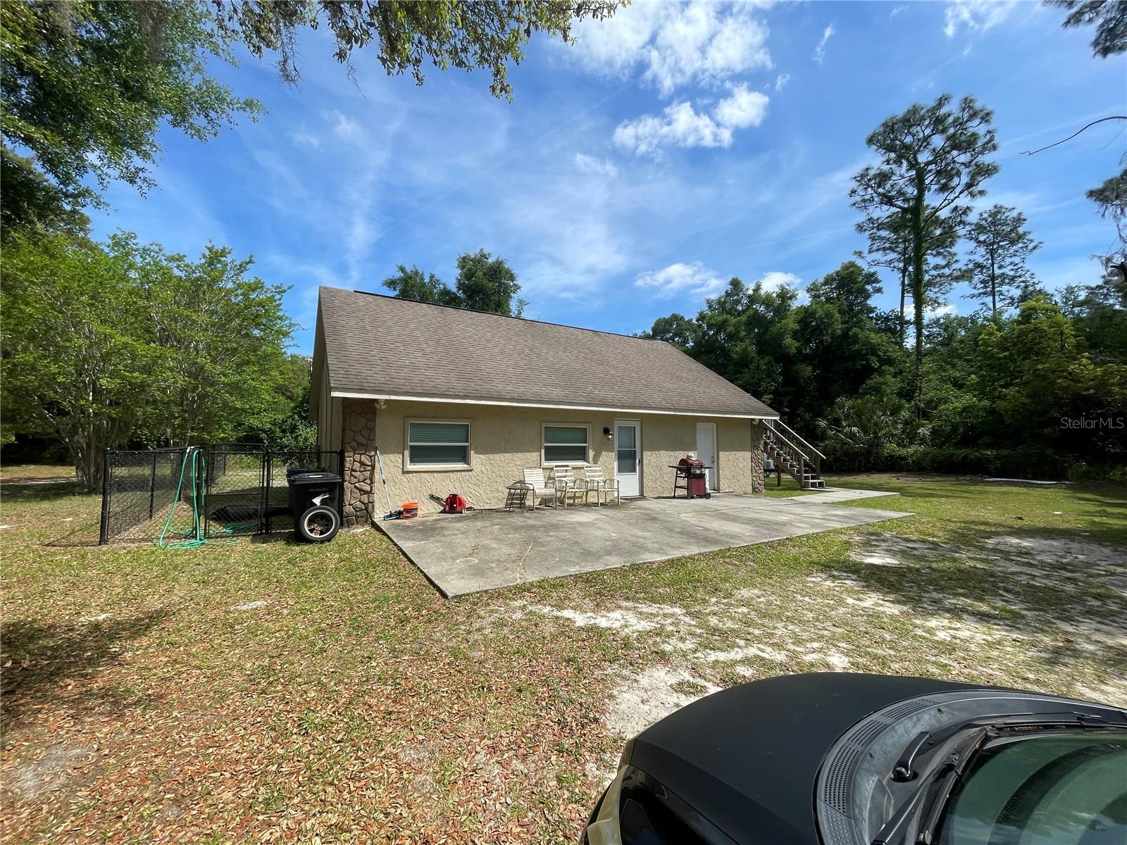 Quiet, peaceful, and private. Built in 2017, this three bedroom, two bath ground-floor duplex home is nearly new (tenant lives in upstairs unit with separate entrance). Features include: wood-look tile floors throughout, tall kitchen cabinets, stainless steel appliances, efficient heat pump, two-inch blinds, ceiling fans, fully fenced yard, lots of storage. Situated on the back of a large lot, you'll enjoy peace and quiet while sitting on the large open patio. Two smaller pets allowed. No HOA, so work vehicle parking is okay. Additional $300 utility fee per month includes water, electric, internet, trash, and access to laundry facilities (washer and dryer included).