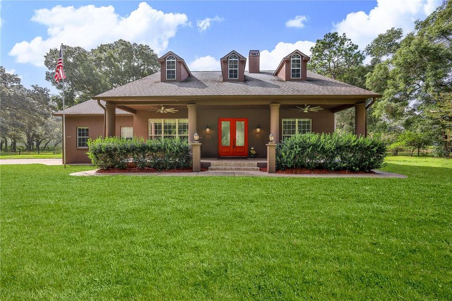 Equestrian dreams are what this property is all about from a functioning barn with separate electrical outlet to rolling pastures that not only encompass this 10 acre farm but the property is also backed along the County Florida WMD so no neighbors coming anytime soon so enjoy the miles of gorgeous terrain with your favorite horse that goes all the way to New Port Richey with no bridges, road etc.  Just saddle up and stroll out your gate with your horse and enjoy the life you have always dreamed of and live your life independently!  This Dream Farmhouse Extraordinaire offers it all from a gorgeous home, rolling pastures, outbuildings, workshop, fruit trees, income producing property, etc. as this list is endless! The essence of this life begins when you turn into the driveway and your met with a gated wrought iron fence that commands respect right from the get-go!  This stunning entrance is via a solar powered keypad which also has a remote as well as an intercom system so visitors can alert you of their presence.  This piece of paradise has it all, beautiful interior, move in ready, split floorplan, open concept, 10ft ceilings, hardwood floors, corian countertops on solid wood cabinets, warm stone wood burning fireplace and all this on over 10 acres of grazing land!  The acreage is gated, fenced and cross fenced and all in a no flood zone! Plan to live off the land because if you can dream it, you can have it!   The exterior and interior of the home has been freshly painted, equipped with new lights, fan fixtures, door locks and appliances purchased in 2021 (dishwasher, washer, dryer & microwave). In the living room you will find a beautiful wood burning fireplace made for those cool winter nights that will warm your heart and make memories to last a lifetime. The stunning chef kitchen has a large walk-in pantry and an island in the middle that allows you the space and freedom to create your own culinary delights for the entire family all while looking out the large windows over your estate.  This split bedroom layout is perfect for those who enjoy master ensuite privacy on one side while the other side of the house has the spare bedrooms with one sharing a jack and jill bathroom. Large laundry room inside that is a must see with its own separate external door that has a coded lock, and if you're coming in from a hard day's work than this is the best entry point with its own shower inside the laundry room so no more tracking the outdoors through the home!  All the porches and decks have newly installed lights along with 72"-inch remote controlled fans to give you extra comfort in the warm summer days.  This property has mature fruit trees (tangerines, grapefruit, loquat, apricot, lime, avocado, orange, grapes), and this list goes on! The roof has a newly installed gutter guards' system so leaves will not even be an issue and 3+ outbuildings which includes a 42x70 pole barn with its own independent electrical panel, 20x40 coup, 20x30 pole barn and a goat cover area. The current owners are using a couple of acres as income producing; storing RV's, trailers, etc. which is done on a month-to-month basis and although they have only just begun, they have already generated $800 month income. So much untapped potential!  Close to major highways (Suncoast Pkwy, 41).  Come and make your memories around a bonfire with family & friends and start living your dream now!  Buyer and buyers agent to verify all measurements, boundary lines.