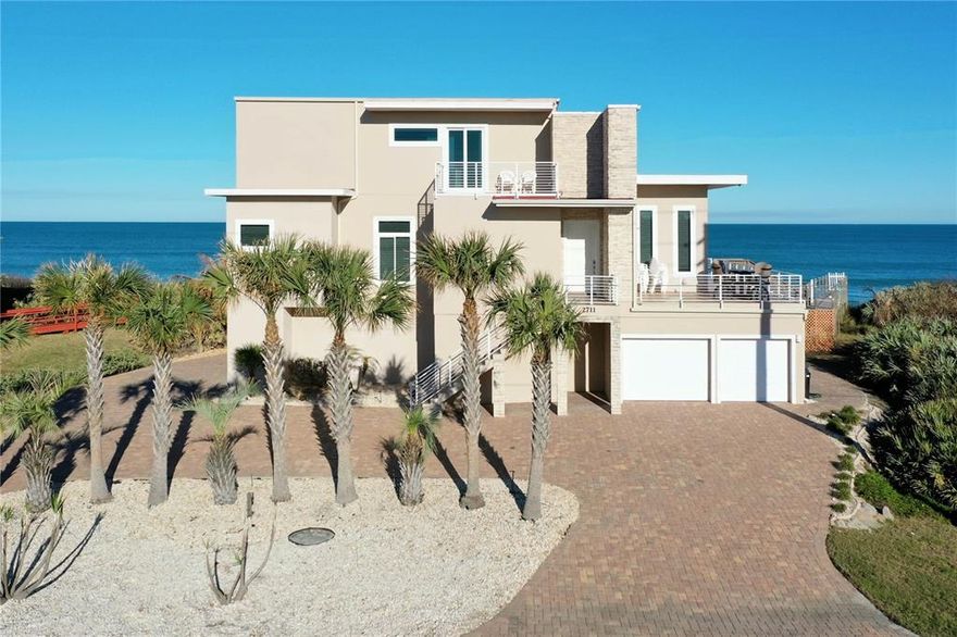 Under contract-accepting backup offers. A ROCKSTAR'S PARADISE with Million Dollar Views from every room! This OCEANFRONT ESTATE showcases 4 bedrooms, 3.5 bathrooms, 3 floors, MULTIPLE BALCONIES encompassing 1184 sqft, gorgeous custom fixtures, an ELEVATOR, custom designed bathrooms, large walk-in closets, walls of tinted windows, an electric fireplace, a custom staircase, 3 BRAND NEW AC SYSTEMS, WATER FILTRATION SYSTEM, A NEW 70 TON WATER HEATER and so much more!! The kitchen features custom European cabinets, exotic granite countertops, stainless steel appliances including a wine cooler and beautiful backsplash tile. The exterior amazes with a brand new pool and spa, outdoor shower, Miami Dade rated pilings and a private beach walkover to the breathtaking cinnamon-sand beach. This amazing home is located on the Northern Flagler Beach that offers over 19 miles of pristine shoreline with plenty of room for sports, surfing, fishing and leisurely strolls! Coined "The Cinnamon Jewel", this luxury home is just a short distance from Historic St. Augustine, Daytona, Jacksonville and Orlando theme parks! Schedule your exclusive showing today for this landmark home!