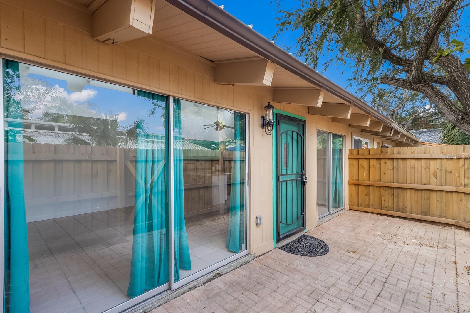 MINUTES TO DOWNTOWN SARASOTA. Ideal location! Charming 2-bedroom villa/condo. With high ceilings and an abundance of natural light, the spacious living areas create a bright, airy atmosphere. Kitchen has new granite countertops and stainless appliances. Ample storage throughout ensures plenty of space for all your belongings including walk-in closet in the main bedroom, storage closet off the kitchen/great room, and loft-like space in the second bedroom, while the two patios offer perfect enjoyment of the casual outdoors. Ceramic tile floors, a new washer and dryer, updated ceiling fans and lighting throughout, and large sliding doors in the main living and bedrooms further enhance the appeal. All condos recently received new shingle roofs. HOA is continuing beautification projects including updated trim, improved sidewalks, and landscape. This cute unit is a a blank slate awaiting your personal design touches.