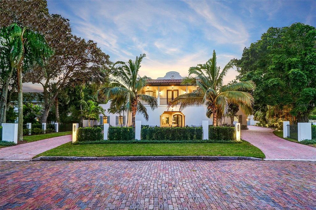 Florida living at its finest! Escape to your very own paradise in this magnificent Spanish Coastal style home situated on over a half acre in the highly sought after neighborhood of Old Pasadena St. Petersburg. Located on a quiet brick lined street, this completely updated 4 / 5 bedroom home boasts an open floor plan with 12’ ceilings encompassing over 7,000 air conditioned SQ. FT. and offers 5 full, 2 half baths, an executive office, a game room, a home theatre, an attached in law apartment, a detached studio, fitness center, and a 7 car garage surrounding a private courtyard highlighted by an amazing one of a kind salt water pool and so much more! Upon entering this amazing home you will easily see that it’s constructed with meticulous detail towards luxurious living while simultaneously presenting a floor plan suited for comfortable everyday living. The bespoke kitchen features include a 60" Lacanche gourmet French range, a large Sub Zero refrigerator, a Sub Zero Freezer, and a Sub Zero 150 bottle wine cooler, hand crafted cabinetry, walk in pantry and a double Island with 3” durable quartz countertops. The opulent first floor master retreat is to die for and features a custom fireplace, sitting area and separate access to the covered veranda/ pool. There is an enormous double shower with soaking tub, double vanities and his & hers walk in closets with custom built-ins. Two ensuite bedrooms are also located on the main living level and are equipped with walk in closets, showers and soaking tubs. There is also a separate entrance guest apartment that allows for flexible living arrangements. Providing even more additional living flexibility is a detached Studio/ 5th bedroom with full bath, fitness center, work shop/ 4 car garage. The second floor has a game room with large covered balcony, a media/ theatre room, and a private executive office. Built with tremendous integrity, this home is constructed with ICF cement walls, hurricane impact windows and doors, has a propane powered whole house (48KW)generator with a 1,000 gallon tank and is built above the flood elevation. Outdoor entertaining is a breeze with a large salt water pool, surrounded by a covered veranda with outdoor kitchen. Located only 5 minutes to award winning Gulf of Mexico beaches, 15 minutes to vibrant downtown St. Petersburg and short 30 minute commute to Tampa Int’l Airport. This home truly has something for everyone. Call to schedule your showing appointment today!!