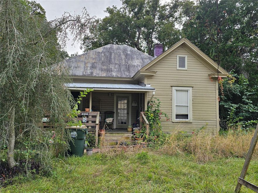Opportunity knocks! Bring your tools and your vision. This 1920's Florida bungalow is full of endless possibilities. If vintage is what your are looking for, then look no further. Cozy cottage has the original hardwood floors, tall ceilings detailed moldings and baseboards. As you enter the wide, spacious foyer there are 2 living areas that each have their own fireplace. The kitchen has a darling walk in pantry. The master bedroom has ensuite bathroom that features a pedestal sink. Nestled on just under half an acre, plenty of room for gardening, a future pool and so much more. Garden shed has plenty of room to store your garden tools. Come make this your own, call your Realtor today.