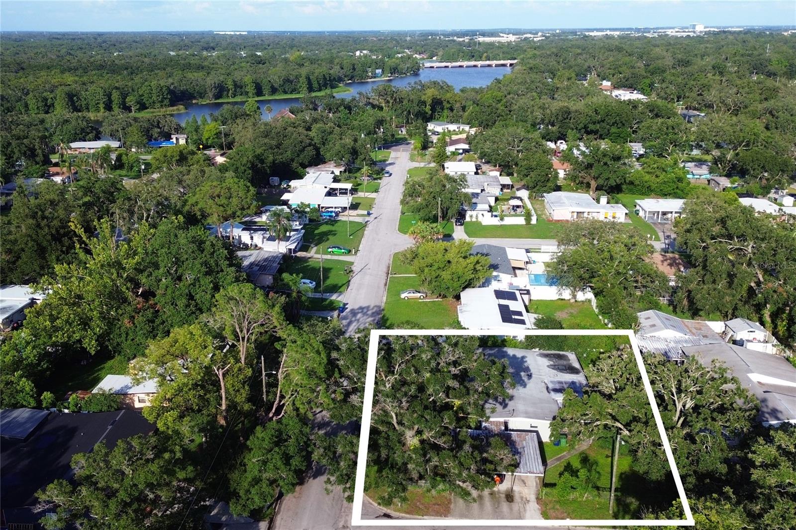 Just two blocks from the Hillsborough River, this 2,096 sqft ranch-style floorplan is perfect for entertaining with 3 large living rooms, 2 screened porches, and a three-car carport all on a 0.22-acre corner lot. Both the back and front yards are fenced in and shaded with beautiful oak trees. Downtown Ybor is only 4 miles away and Channelside is only 5 miles away from this excellent location. Come check it out before this opportunity disappears!