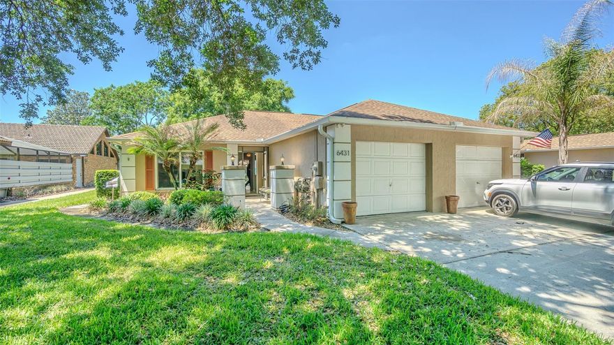 Welcome Home to your Maintenance free, barely used villa in Sunny Florida!  Perfect vacation or second home as a lock and leave property in an established community! From the moment you arrive to this beautifully maintained villa, tucked away on a quiet cul-de-sac, you will notice the attention to detail. Brick accents and open courtyard with screened front entry invites you to this 2-bedroom, 2-bath home highlighted by soaring 12-foot ceilings, newly painted interior and an open, airy layout. The kitchen, with can lights in the tray ceiling is Light, bright and functional, stainless steel appliances with smooth top range and an eat in dinette space and window for natural light. Breakfast bar is OPEN to the spacious dining area and great room featuring raised ceilings, with sliding glass door extending your entertaining and living space on your 17x25 expansive lanai, perfect place to spend relaxing evenings, entertaining guests, or enjoying stunning sunset views, with a separate open area patio for grilling.  Dont miss the hand painted mural and private LUSH, oversized backyard for a serene setting! The primary suite provides an owners retreat with a walk-in closet and bath ensuite, while the second bedroom is thoughtfully positioned on a separate wing, overlooking the front lawn, on opposite side of the home for added privacy. This home features many upgrades including 2024 Water Heater, 2018 Roof and AC, laminate floors throughout the common areas, tile in foyer, kitchen and baths, updated lighting, bathroom framed mirrors Located in Silver Oaks community with no CDD fees and low quarterly HOA.  Located north of Tampa just minutes from shopping, dining, medical facilities, and the Sarah Vande Berg Tennis Center, with easy access to Tampa, Orlando, Wesley Chapel and major highways for easy commute to Airports and Florida's sandy beaches!  CALL TODAY!