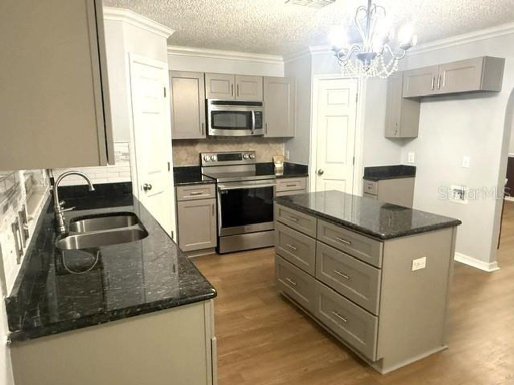 Photo of 409 Yearling Cove Loop, Apopka, FL 32703 (MLS # O6424670)