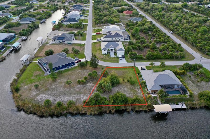 Discover an exceptional opportunity to build your dream waterfront home on this .25-acre (11,101 sq ft) buildable lot in the highly sought-after boating community of South Gulf Cove. Perfectly positioned on a canal (with three fixed bridges) leading to direct Gulf access, this prime property offers both privacy and breathtaking sunset views thanks to its unique canal orientation. This property has public water and sewer available. Located at the President Waterway, the property enjoys expansive water views and easy navigation through the community lagoon. From your backyard, cruise effortlessly through the waterways and lock system into Charlotte Harbor, where the Myakka River and Peace River meet, and continue on to the Gulf of Mexico—a true boater’s paradise. South Gulf Cove offers an array of desirable amenities, including optional HOA membership and an optional Yacht Club, a community recreation center, parks, and a public boat ramp. The location is ideal, just a short drive to the pristine beaches of Boca Grande, Englewood Beach, and Manasota Key, as well as nearby shopping, schools, churches, and local attractions. Sports enthusiasts will appreciate being only 15 minutes from the Charlotte County Sports Complex, the spring training home of the Tampa Bay Rays and home of the Charlotte Stone Crabs. This is a rare opportunity to secure a premier waterfront lot in one of the area’s most desirable communities. This property is approximately 20 minutes from US-41 and 30 minutes from I-75 for easy access North and South thrhoughout the state.