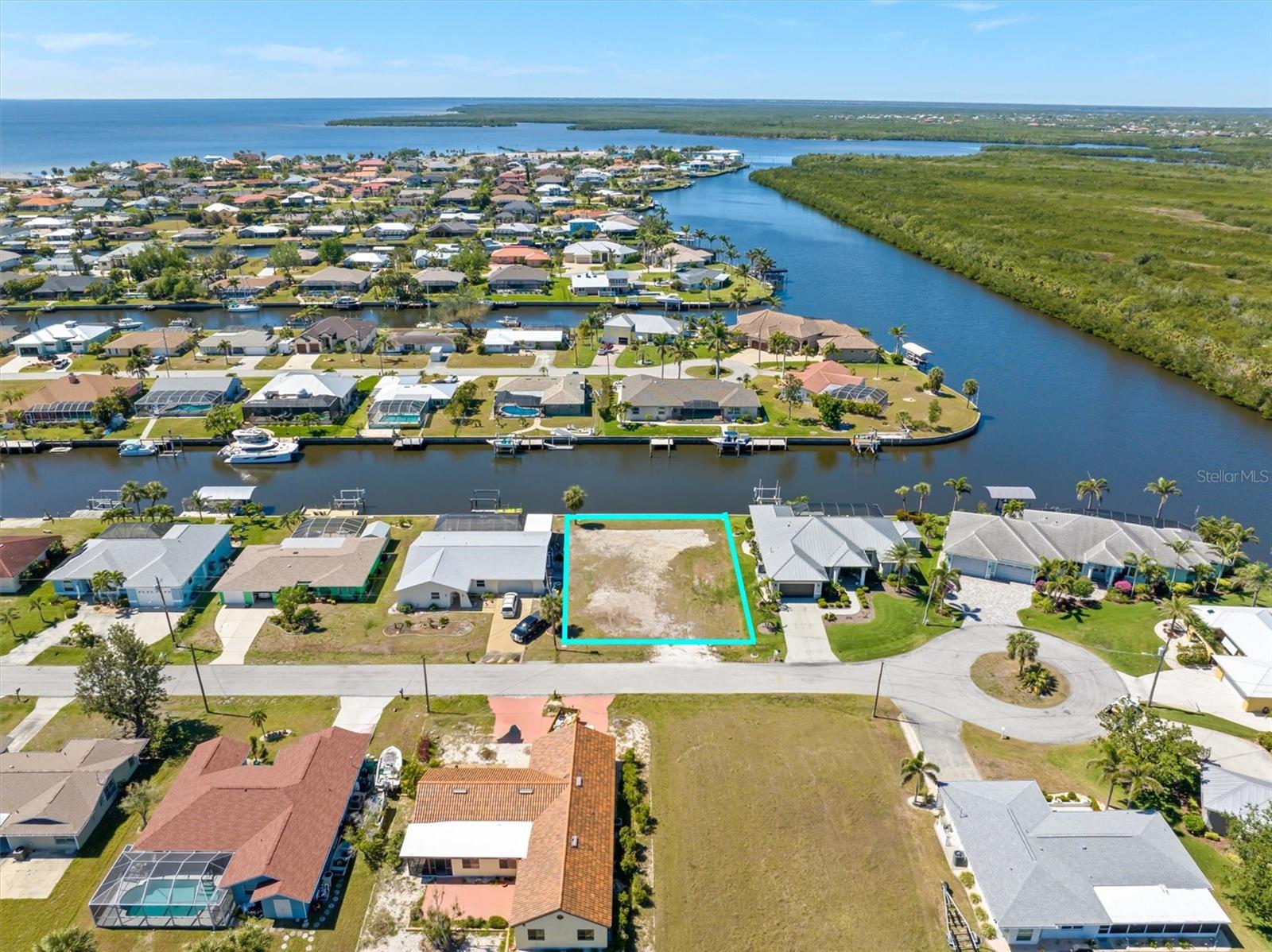 EXCELLENT LOCATION ON DEEP AND WIDE SALTWATER SAILBOAT CANAL (no bridges). Just a few minute cruise to open water at the mouth of Alligator Bay and Charlotte Harbor. Brand NEW SEAWALL in 2024 providing great savings and long term peace of mind. Nearby county preserve provides outlet for high water and a spectacular foreground for viewing the glorious sunset from your very own piece of paradise. Located in the desirable Buena Vista Section and a short distance to the Port Charlotte Beach Park at the end Harbor Blvd. The park is home to public swimming pool, boat ramp, volleyball courts, sandy beach, fishing pier, and playground. Come see this perfect home site for boaters and naturalist alike. Build your dream home and enjoy all southwest Florida has to offer.